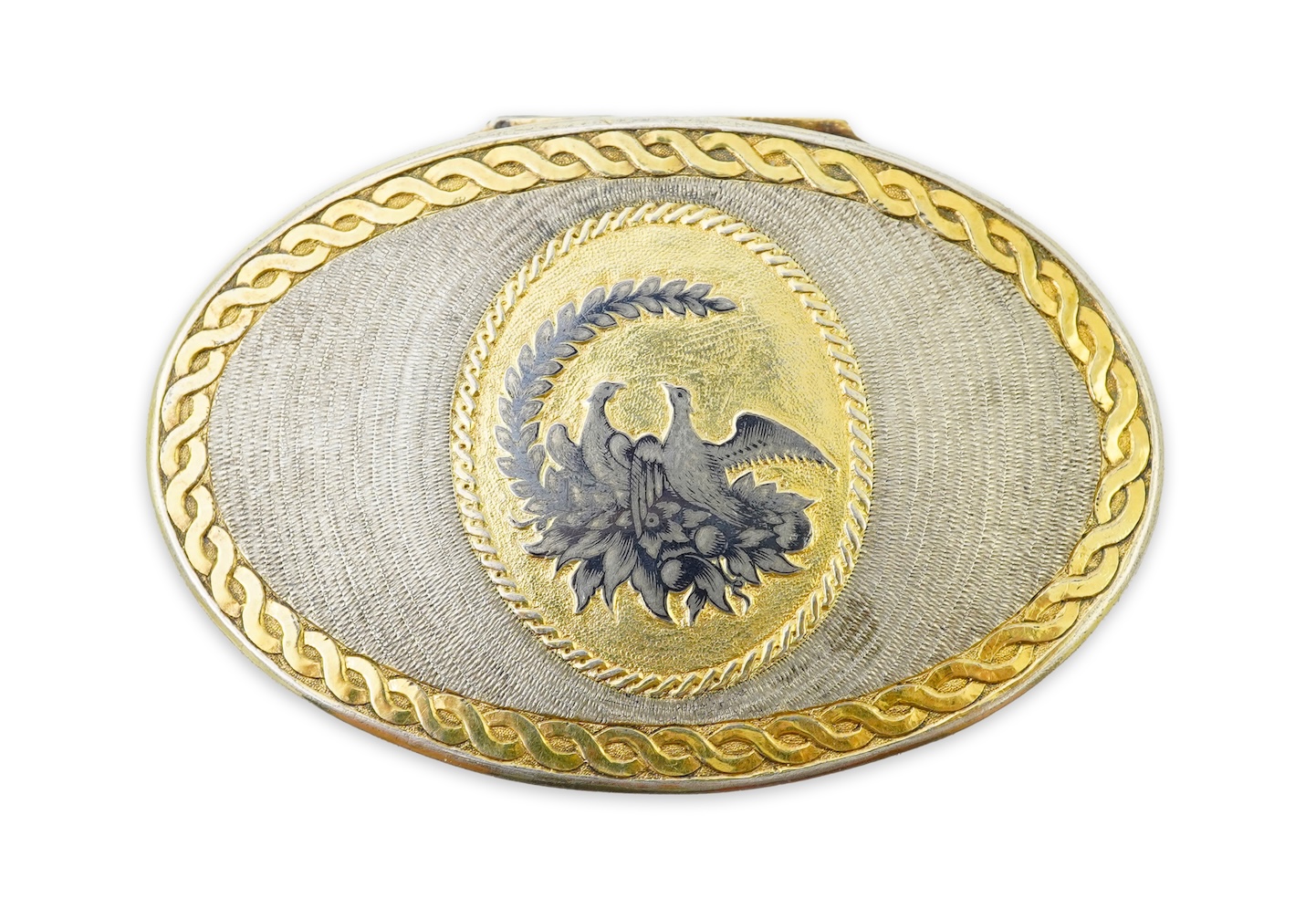 A 19th century Swiss? parcel gilt white metal oval snuff box with hinged cover